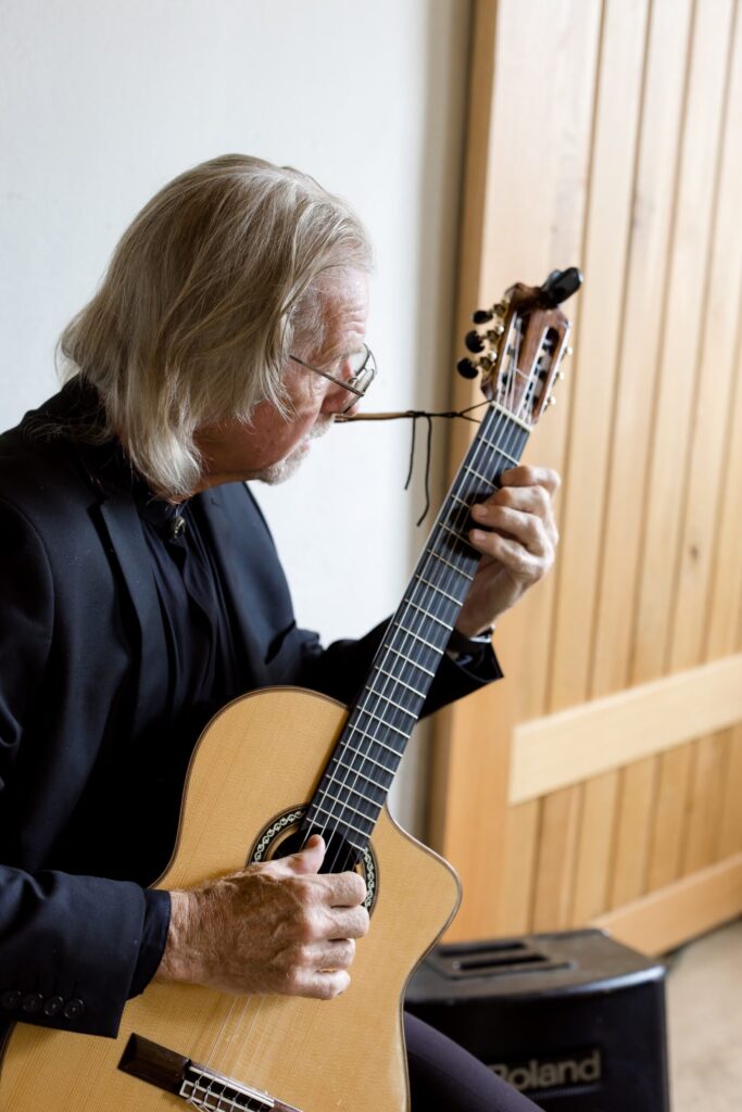 Jerry playing guitar at wedding